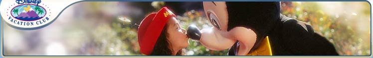 Girl greets Mickey with a kiss at a Disney Park